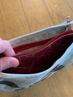 La pochette a 3 tasche 1